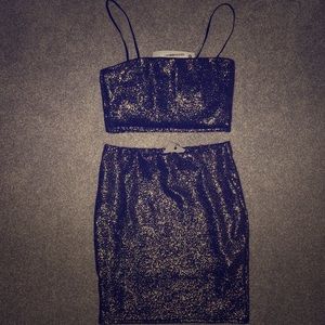 gold sparkly crop top and mini skirt